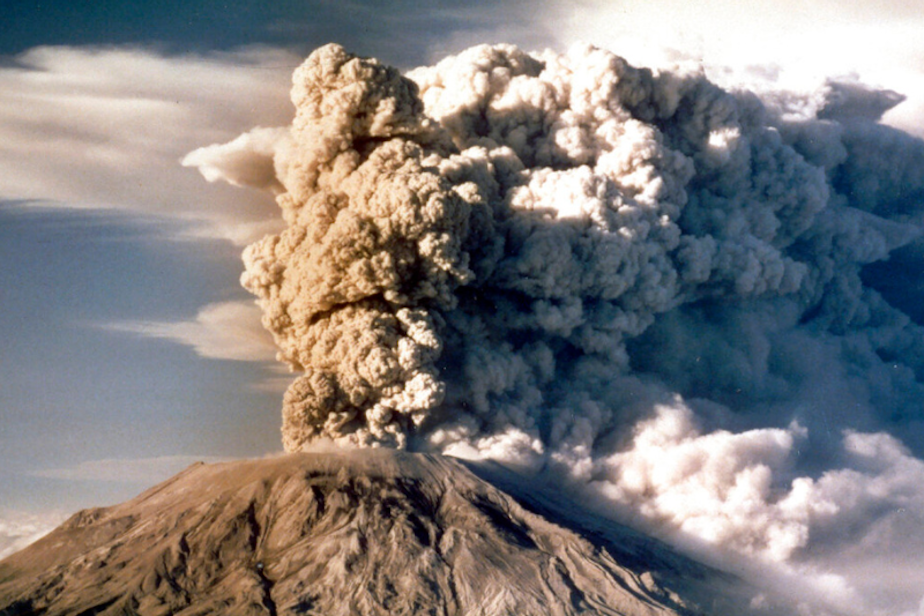 caption: Mount St. Helens in Washington spews smoke, soot and ash into the sky in April 1980.